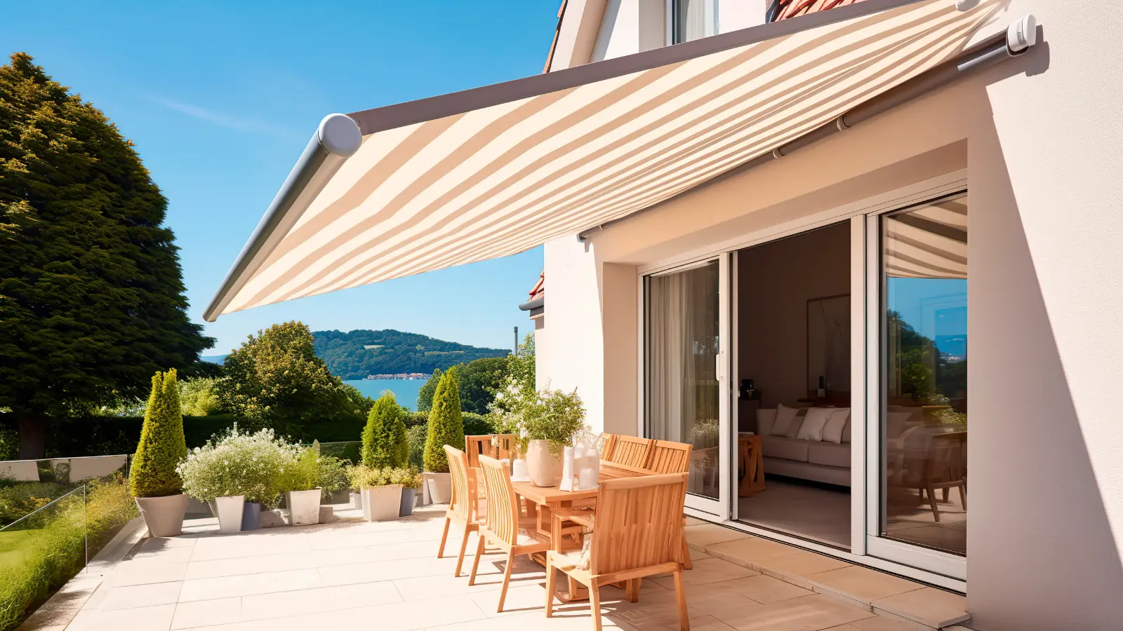 An awning on a patio with a view of a lake.
