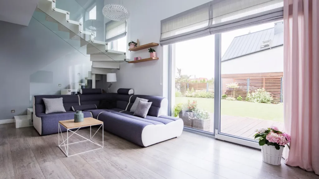 A living room with stairs and a couch.