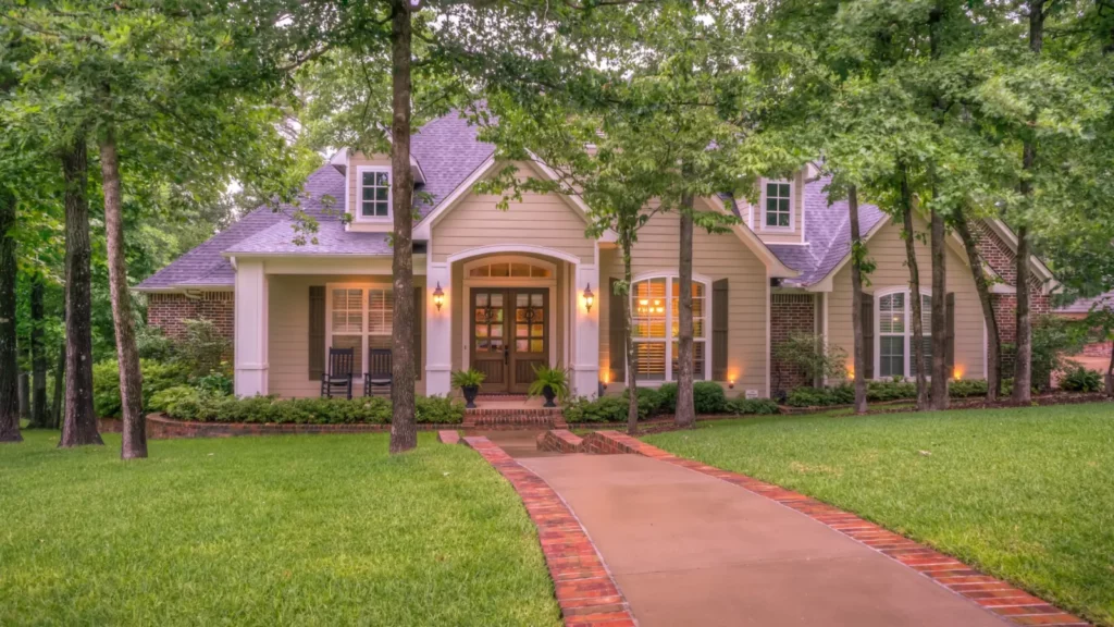 A home with a brick pathway in the woods