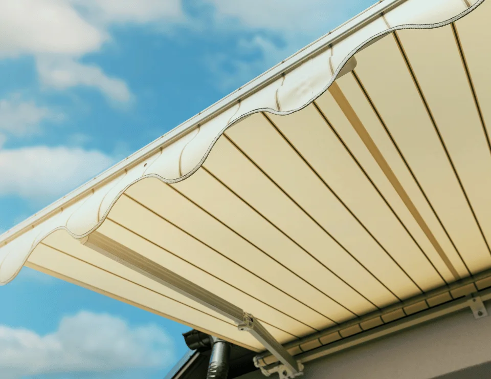 A retractable awning with scalloped trim.