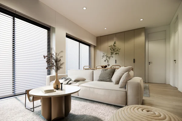A white living room with wooden blinds and a coffee table.
