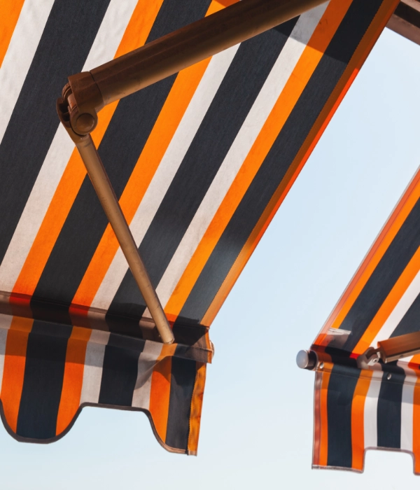 An orange and black striped awning.