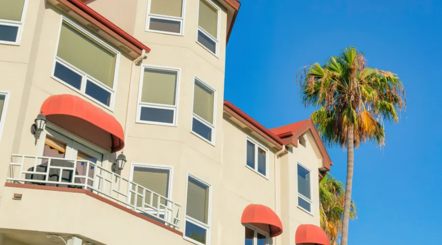 An apartment building with dome awnings.