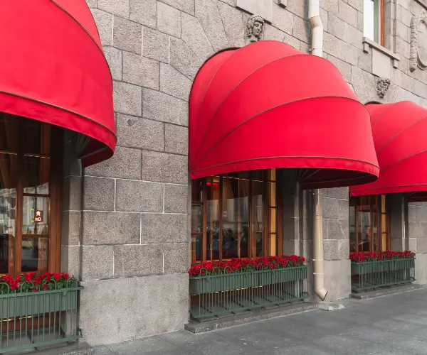 Red dome awnings on a business front.