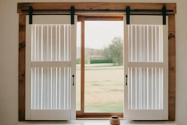 Sliding shutters in a rustic home.