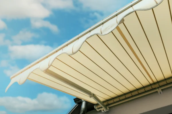 An awning over a residential patio.