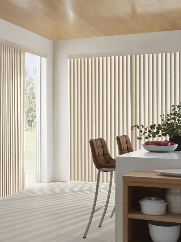 Brown window treatments complement the decor of a beige modern living room.