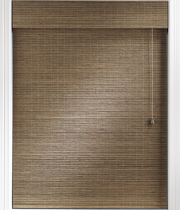 A window with natural-finish woven wood roller shades