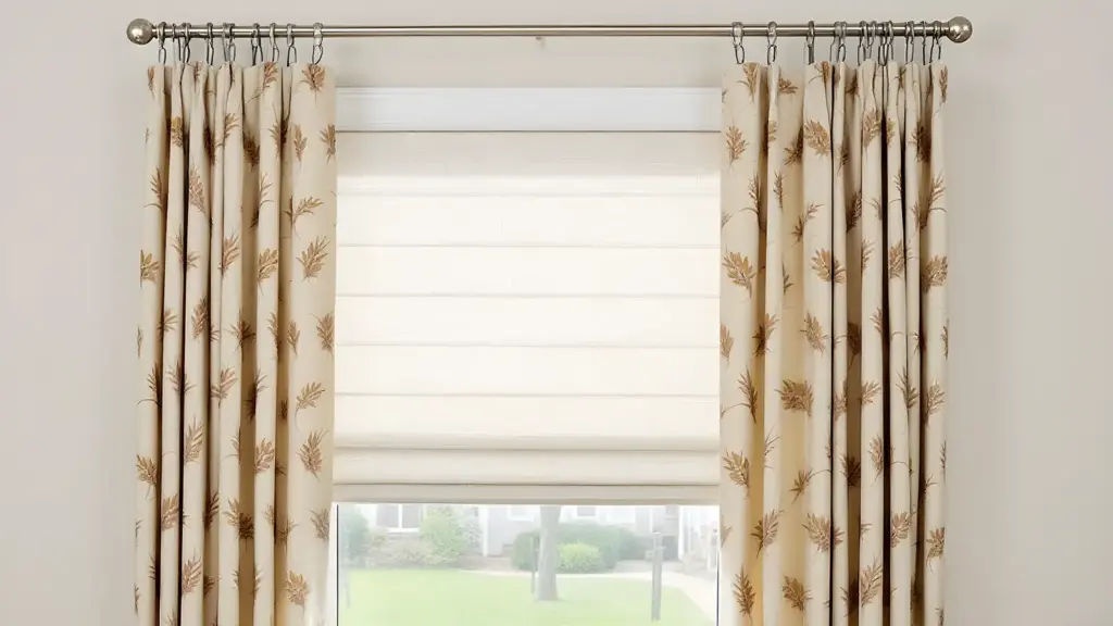 Curtains layered with Roman shades