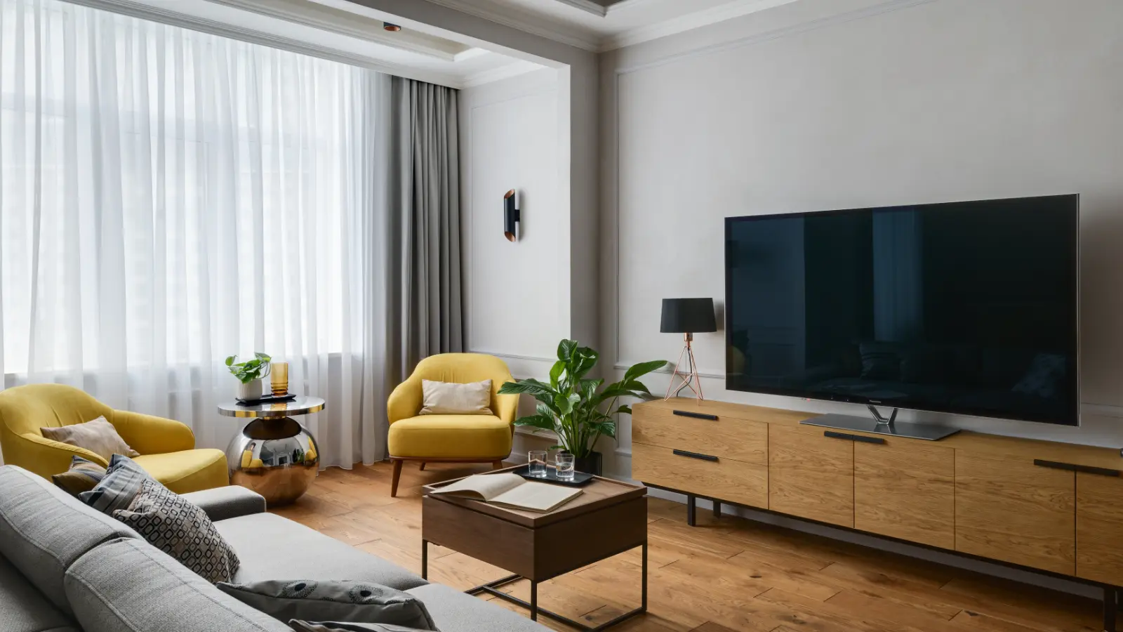 Contemporary living room with layered curtains